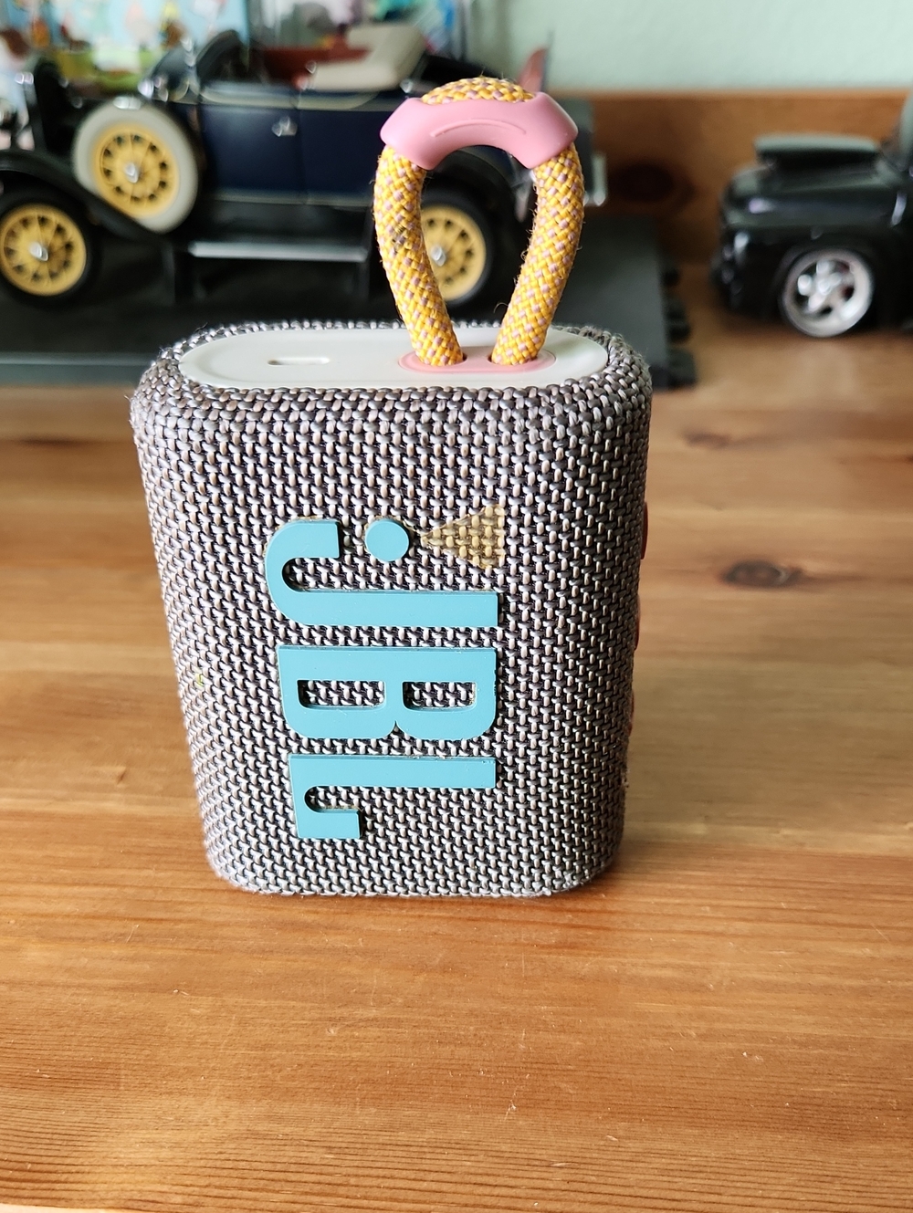 JBL Go3 Portable Bluetooth Speaker — Gray Fabric with Yellow and Pink Loop